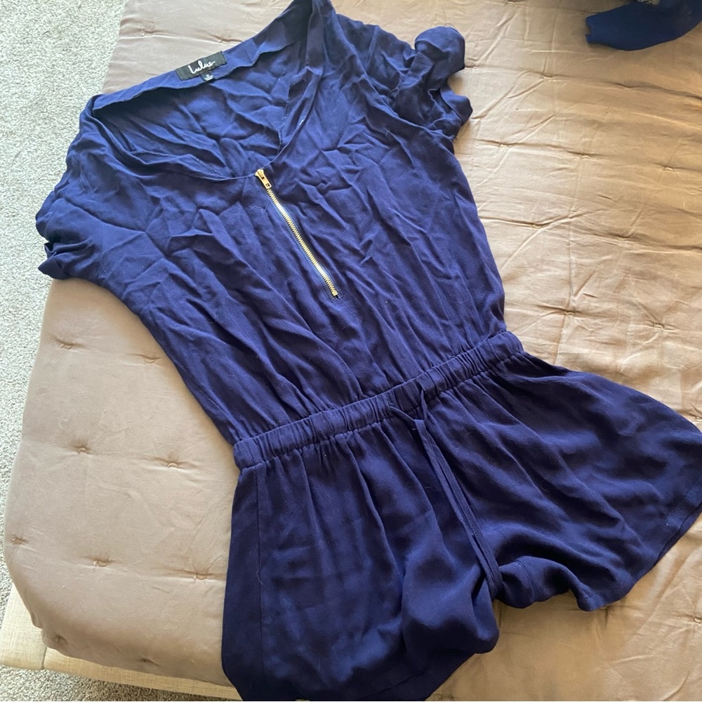 Lulus short sleeve romper with gold zipper. Size small.